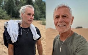 Two men wearing silver necklaces