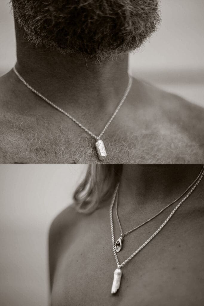 Unisex jewelry in silver shaped after grains of sand on a male and a female